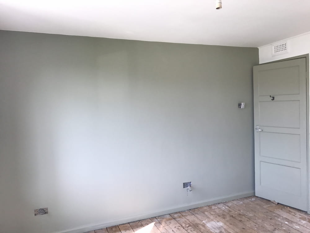 newly-decorated-wall-with-olive-paint